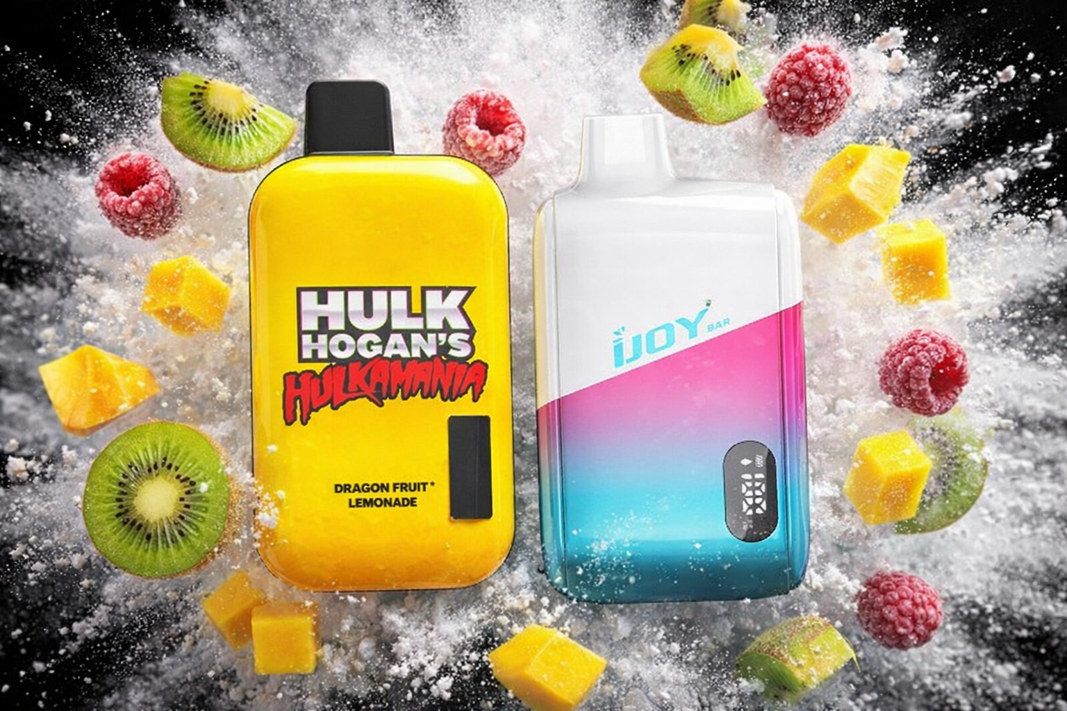 The photo shows two colorful vape devices placed side by side in a dynamic fruit-themed composition. The bright yellow device labeled “HULK HOGAN’S HULKAMANIA” highlights the flavor “Dragon Fruit Lemonade,” while the gradient white-pink-blue device reads “iJOY BAR.” Surrounding kiwi slices, raspberries, and mango cubes burst outward with powdered mist, creating a lively and energetic atmosphere that emphasizes fruity freshness.